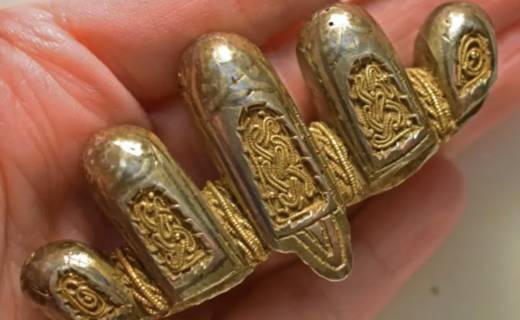 Electrician finds gold Viking sword in fields near quiet English village