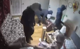 Elderly woman forced to watch as intruders steal belongings from her home