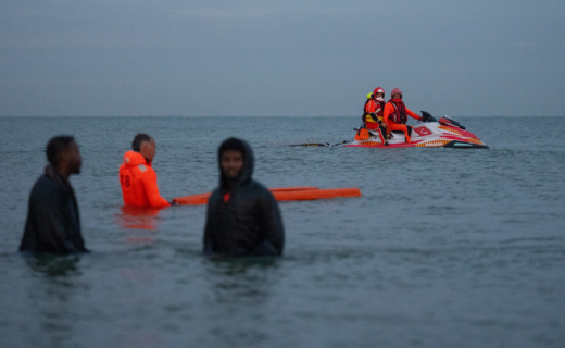 Stranded small boat migrants tugged to shore by jetski after breaking down in Channel