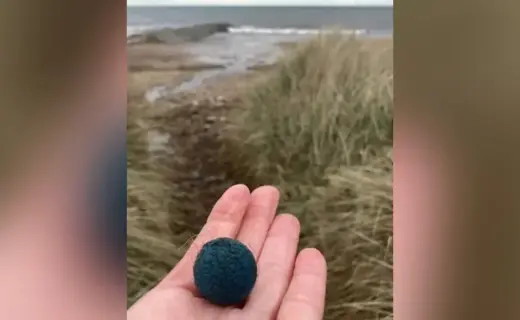 Dozens of mysterious blue balls found scattered on British beach after being released from nuclear power station