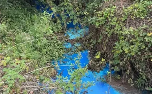 Mystery pollution turns water bright blue at popular beauty spot as Britons warned 'do not swim'