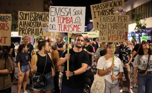 Anti-tourism protesters revolt at popular British holiday destination as they lash out at 'overcrowded' beach